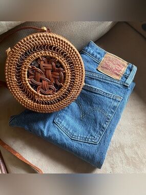 Levi's 501 jeans and woven purse